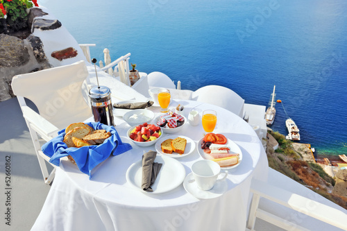 Photo: Breakfast on a terrace overlooking the sea in Oia Breakfast on a terrace overlooking the sea in Oia