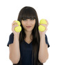 Woman tennis player holding a racket and balls, isolated on a wh