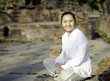 Smiling woman meditating
