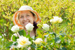Mature woman in rose plant