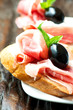 Sandwiches with prosciutto olive on plate