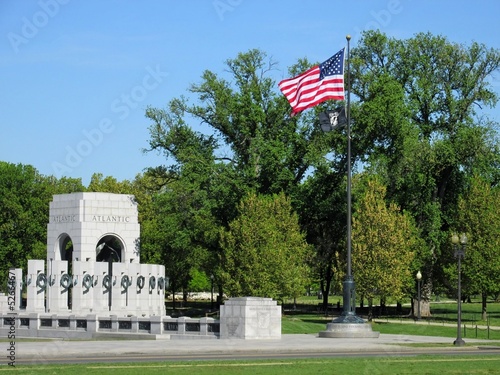 Photo: WW II memorial and american and POW flags flying WW II memorial and american and POW flags flying