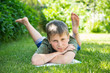 Photo: boy with a book on the grass boy with a book on the grass