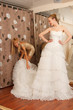 Two girlfriends Having fun in bridal Boutique