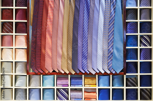 Photo: Ties collection on the shelf of a shop Ties collection on the shelf of a shop