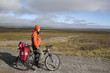 girl cyclist on the background of the tundra