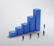 Illustration: Tiny people standing around a bar graph Tiny people standing around a bar graph