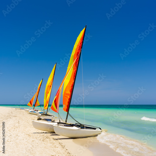 Photo: Colorful sailing boats on a cuban beach Colorful sailing boats on a cuban beach