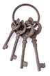 four rusty keys on a ring on a white background
