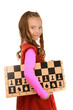 smiling schoolgirl with chess board