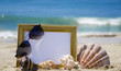 Photoframe on sandy beach