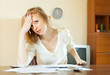 pensive woman reading  documents