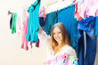  woman hangs clothes to dry
