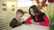 Mom teaches son to draw