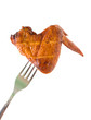 smoked chicken wing close-up on white background