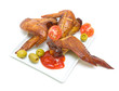 Smoked chicken wings close-up on a white background