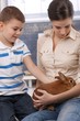 Cute kid and mum with pet bunny