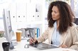Young designer at desk with drawing pad