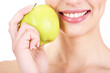 Smiling woman with apple close up