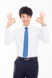 Young Asian business man showing okay sign.