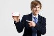 Photo: Businessman holding a business card Businessman holding a business card