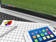 Macro view of Laptop with Documentation and Smartphone