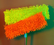 Two mops for floor on bright background