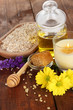 Fragrant honey spa with oils and honey on wooden table close-up