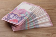 Ukrainian money on wooden background