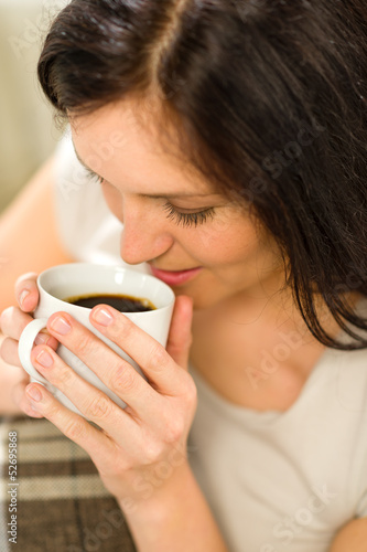 Photo: Relaxing woman drinking hot beverage for enjoyment Relaxing woman drinking hot beverage for enjoyment