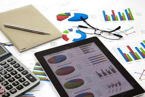 Photo: business workplace with stock market data business workplace with stock market data