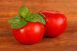 Tomato and basil on wooden background