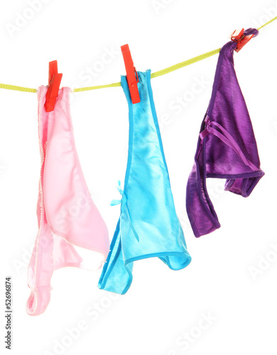 Photo: Women's panties hanging on rope isolated on white Women's panties hanging on rope isolated on white