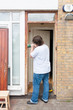 Photo: Man sanding down the front door Man sanding down the front door