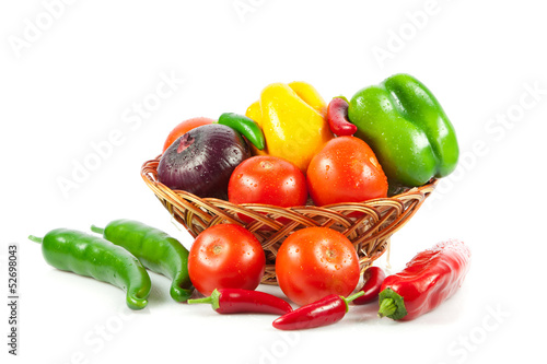 Photo: Fresh vegetables in basket isolated on white. Bio Vegetable. Co Fresh vegetables in basket isolated on white. Bio Vegetable. Co