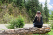 Photo: Lonely woman alongside a mountain road Lonely woman alongside a mountain road