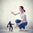 Businesswoman puppeteer