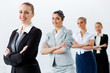 Four businesswomen standing in row
