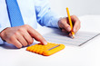 Hand with calculator.