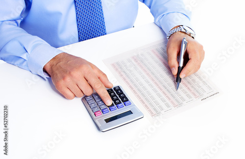 Photo: Hand with calculator. Hand with calculator.