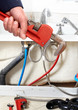 Hand with wrench. Plumber.