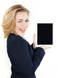 Business woman winking over her tablet pc with copyspace