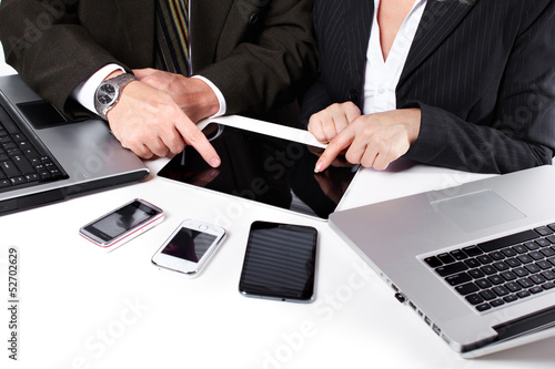 Photo: Business people group working with laptop. Business people group working with laptop.