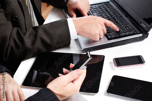 Photo: Business people group working with laptop. Business people group working with laptop.