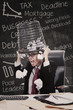 Photo: Angry businessman hold rubbish bin in class Angry businessman hold rubbish bin in class