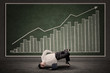Businessman dancing in front of profit bar chart