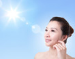 Photo: Beautiful woman face with sunshine and sky Beautiful woman face with sunshine and sky