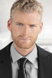 Close-up of young man in suit