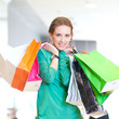 Foto: Shopping woman with color bags Shopping woman with color bags