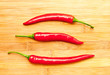 Three red chili peppers